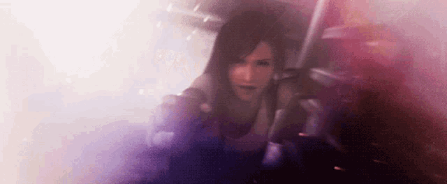 a woman is holding a gun in a foggy area