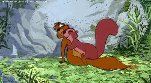 a couple of squirrels are hugging each other in a cartoon .