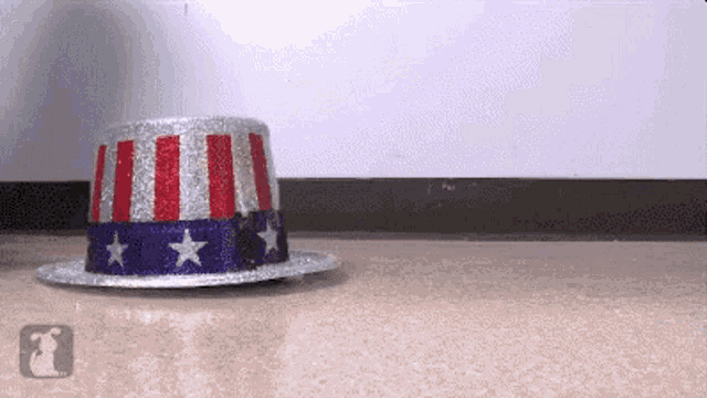 a red white and blue top hat with stars on it is on the floor