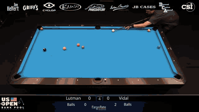 a pool table with the us open bank pool championship on the screen