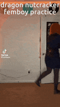 a woman in a blue dress is dancing in a room with a door .