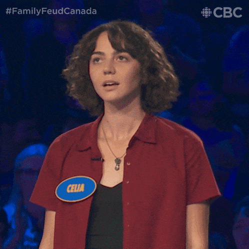 a woman wearing a red shirt with a name tag that says celia