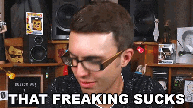 a man wearing glasses and a black shirt says that freaking sucks