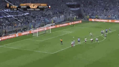 a soccer game is being played in a stadium with gatorade advertisements on the sidelines