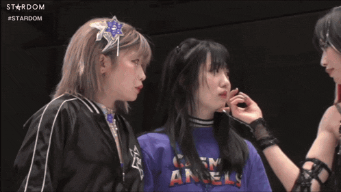 two women in a wrestling ring with the word stardom on the bottom left