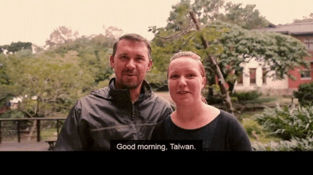 a man and a woman are standing next to each other with the words " good morning taiwan " above them