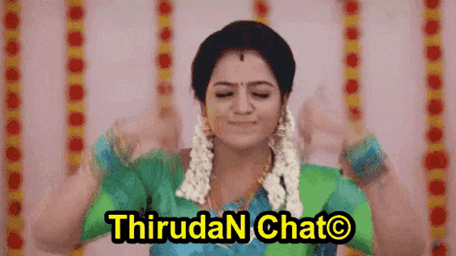 a woman in a green and blue dress says thiruda n chato