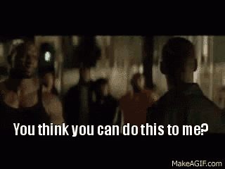 two men are standing next to each other and one of them is asking the other if he can do something to him .