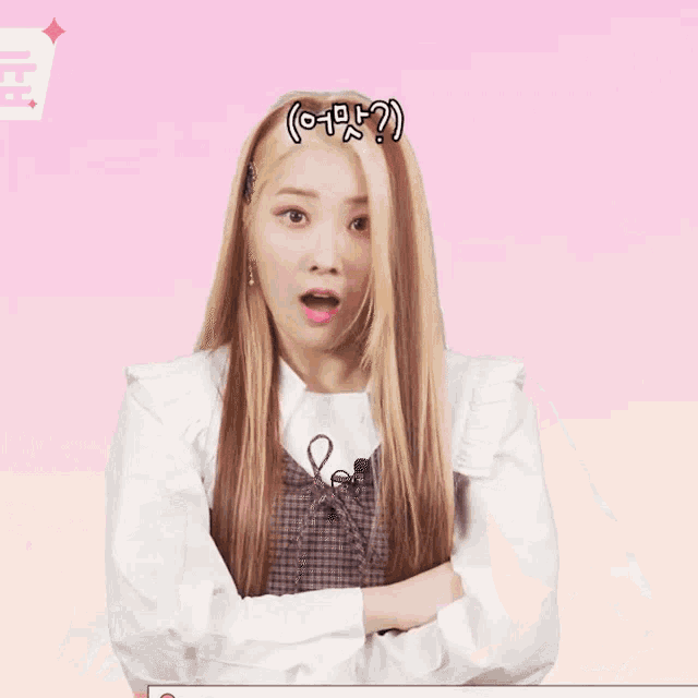 a woman with long blonde hair has a pink heart in her hair