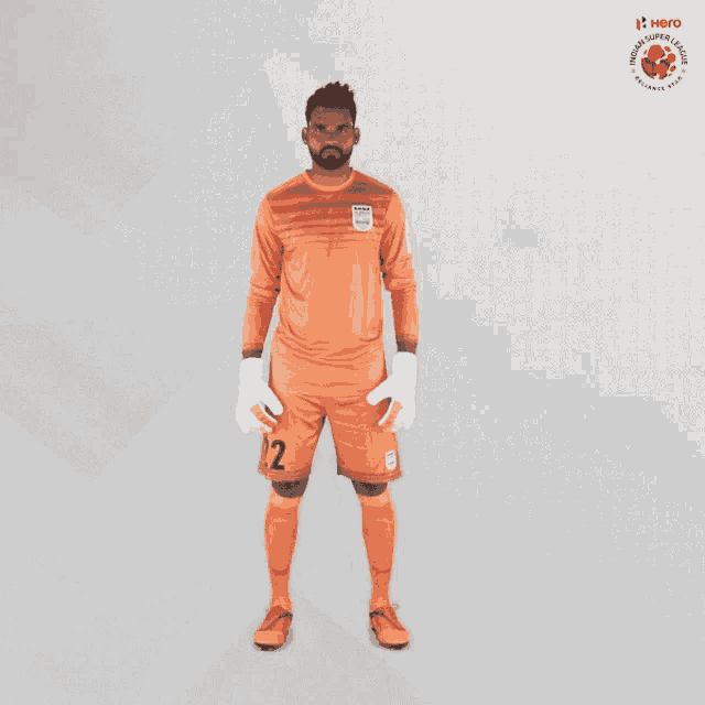 a man in a soccer uniform with the number 12 on it