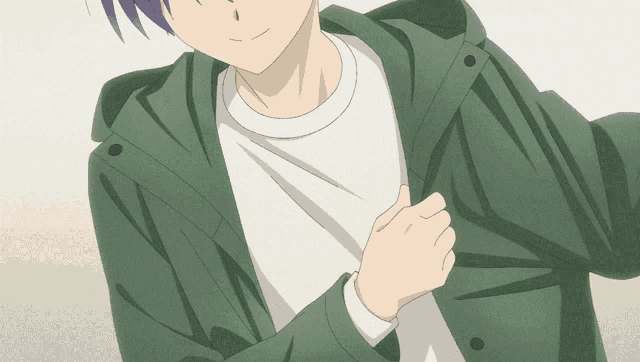 a close up of a person wearing a green jacket and a white shirt