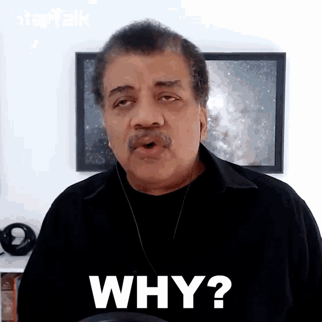 a man with a mustache is asking why