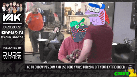 a poster for dude wipes shows a group of people sitting around a microphone