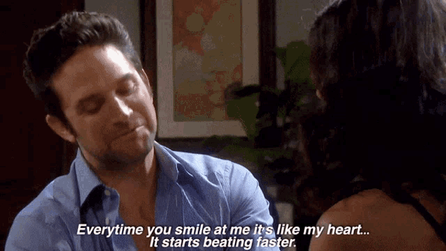a man smiles at a woman who says everytime you smile at me it 's like my heart it starts beating faster