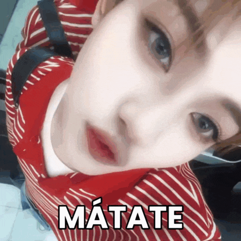 a close up of a person 's face with matate written on the bottom right