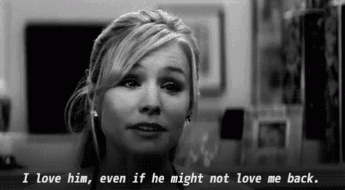 a woman is crying in a black and white photo with the words i love him even if he might not love me back