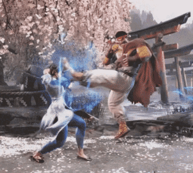 a man in a red cape is kicking a woman in the face
