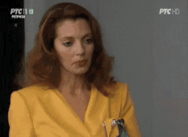 a woman in a yellow jacket is on ptc 1