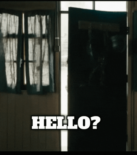 a dark room with a door open and the words hello on the bottom