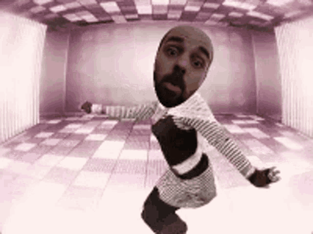 a man with a beard is dancing in a purple room