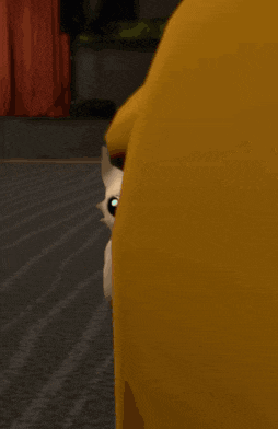 a cartoon cat is standing next to a large yellow duck .