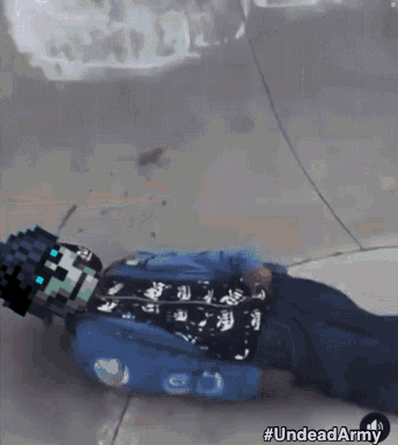 a pixel art of a person laying on the ground with the hashtag #undeadarmy