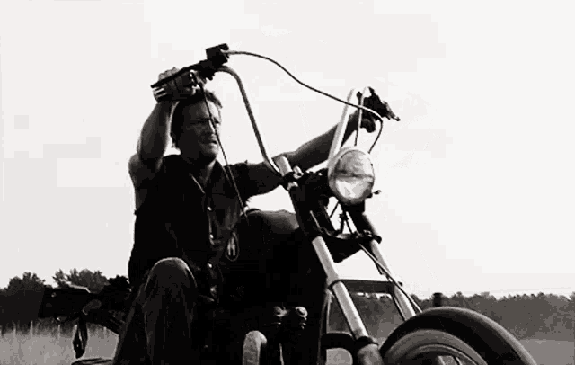 a man is riding a motorcycle with the letter a on the front
