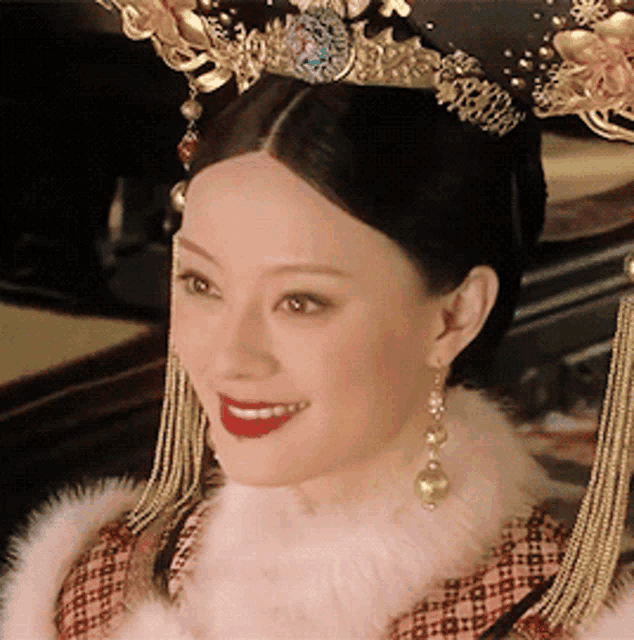 a close up of a woman wearing a crown