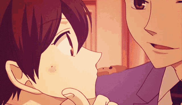 a man and a woman are kissing in an anime