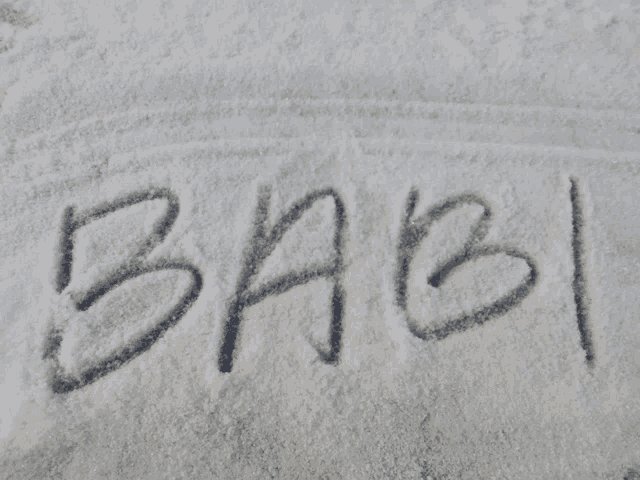 the word babi is written in the snow on a white surface