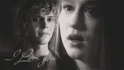 a black and white photo of a man and a woman with the words `` i love you '' on the bottom .