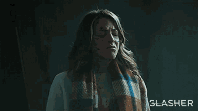 a poster for a movie called slasher shows a woman with blood on her face