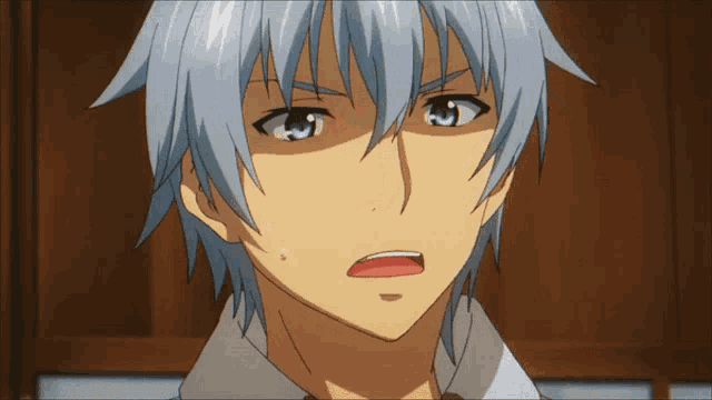 a close up of a person 's face with blue hair