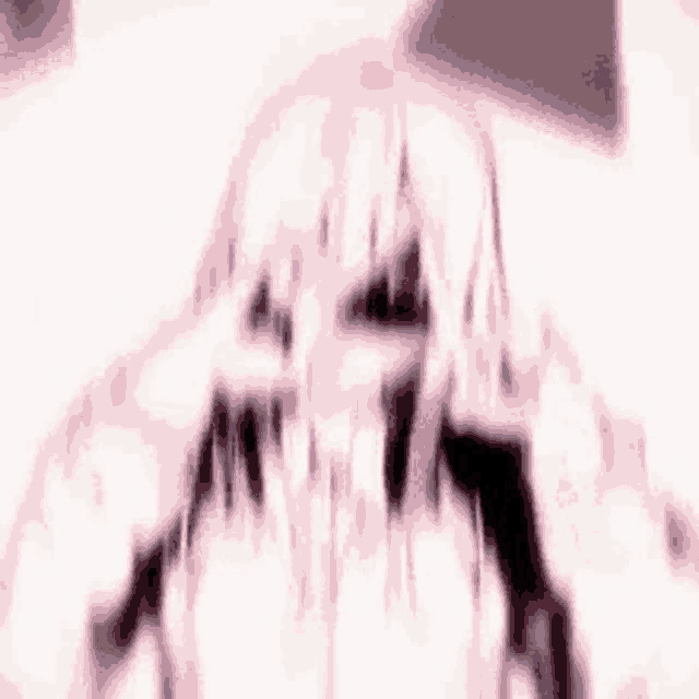 a blurry picture of a girl with long hair and a skull on her face .