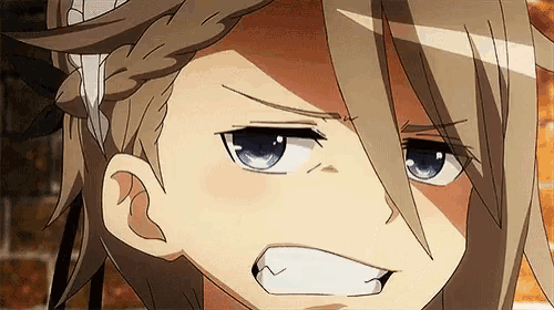 a close up of a person 's face with a very angry look on it