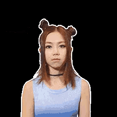 a woman in a blue tank top is being patted on the head