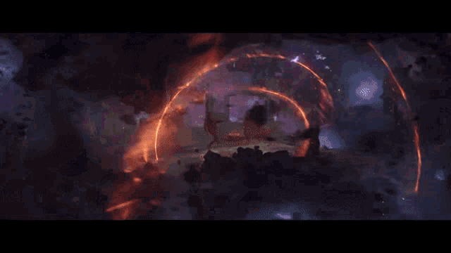 a man is standing in front of a large fire