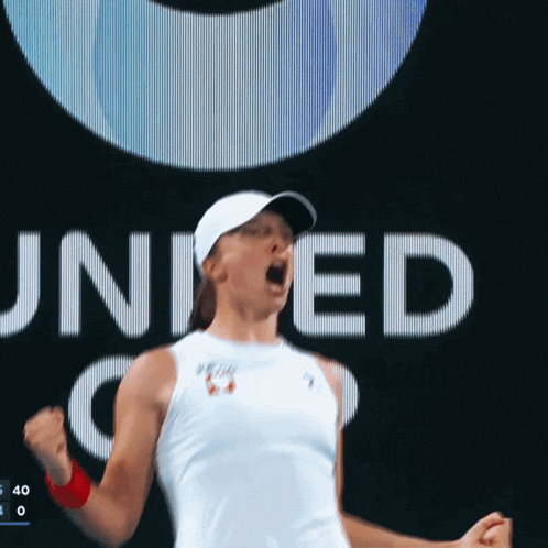 a woman with her fist in the air in front of a united states logo
