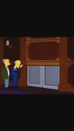 two men are standing in front of a door with a skull and crossbones on it .
