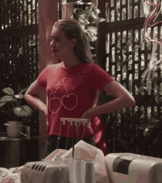 a woman in a red shirt that says i 'm sweet