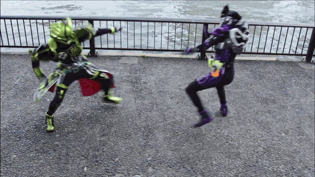 a man in a green and purple outfit is fighting another man in a purple outfit