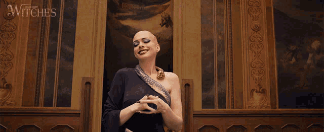 a woman with a snake around her neck says shut up in front of a painting