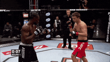 two men fighting in a ufc ring with 0:07 round 1 on the clock