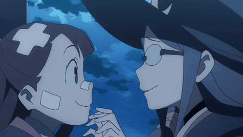 a girl with a bandage on her head is looking at another girl with glasses