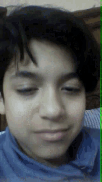 a close up of a person 's face with a green border around the bottom