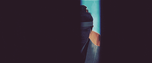a man in a kimono with a bun on his head