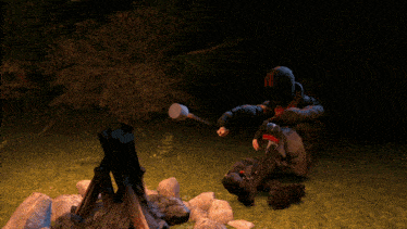 a man in a helmet is roasting marshmallows over a fire