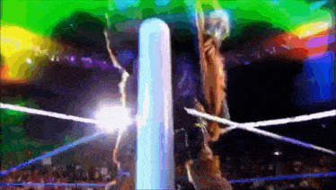 a man is standing in a wrestling ring with a rope around his waist