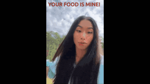 a woman holding a bag that says your food is mine on it
