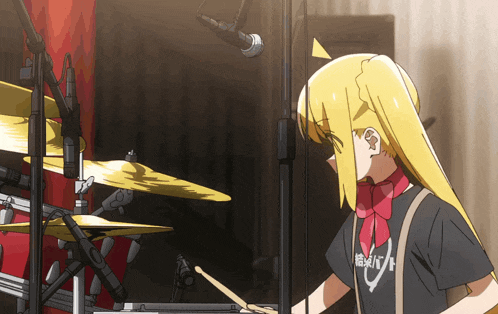 a girl playing drums with a shirt that says " rhythm " on it